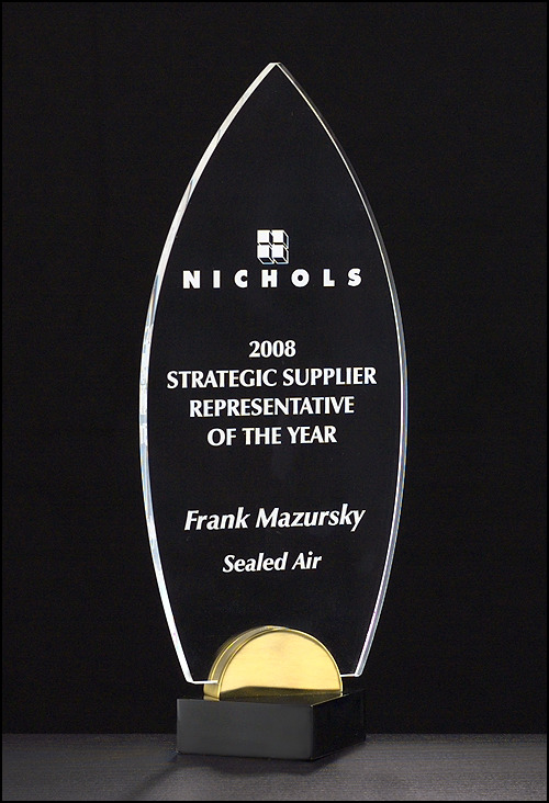 Acrylic Award on Black and Gold Metal Base.